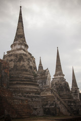Fototapeta premium Ancient break pillar pagoda and sky at wat phra sri sanphet temple Ayutthaya Thailand
