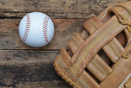 Baseball game. Baseball ball on wooden background.