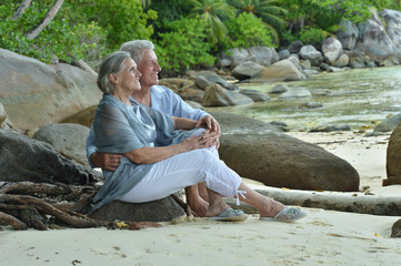 Elderly couple rest at tropical resort