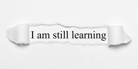 I am still learning on white torn paper