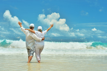 Elderly couple rest at tropical resort