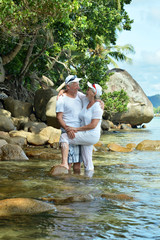 Elderly couple rest at tropical resort