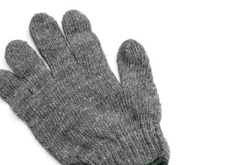 Left grey knitted glove on white background
