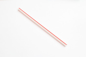 red straw for drinking on white background