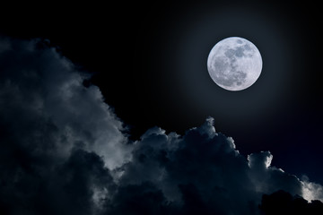 Naklejka na ściany i meble Full moon in cloudy day.