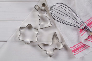 Making homemade sugar cookies. Cookie cutters  and kitchen tools on parchment paper