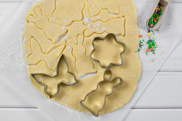 Making homemade sugar cookies in a variety of forms. Roll out the dough.  