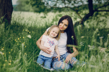 Fototapeta premium child near tree with mom