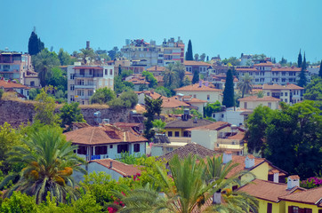 Fototapeta premium The roofs of the old houses of the city from the red tiles found in the tour of Antalya