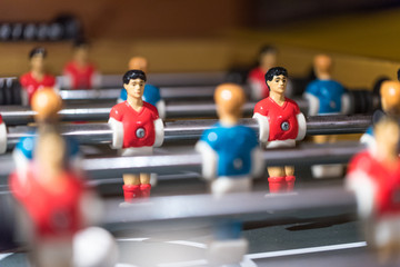 Table football kicker with miniature players - obrazy, fototapety, plakaty