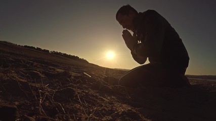 man praying god sunset sitting sun silhouette sunlight the religion