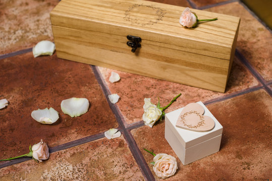 wooden Caskets and rosw petals card