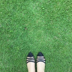 Close up of stylish female shoes. Outdoor fashion shoes footwear concept on grass background great for any use.