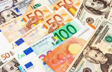 Background of different currency. Euro banknotes and american dollars