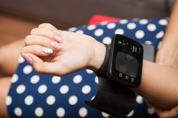 Tonometer on a hand of the girl