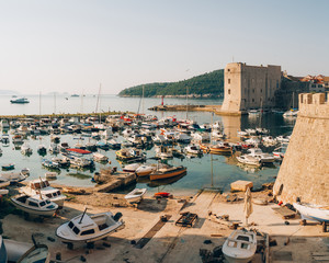 The boat dock near the old city of Dubrovnik, Croatia. The harbor, a marina, near the ancient city.