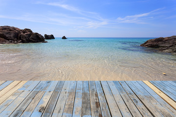 wood floor on sea surface summer wave background, landscape with clouds on horizon,beautiful natural tropical sea .