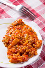 Stew with tomato paprika rise served on the table