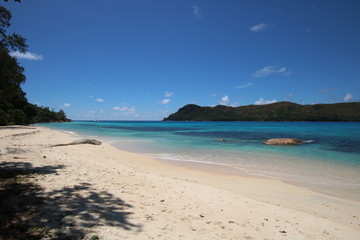 Anse Boudin Beach, Praslin Island, Seychelles, Indian Ocean, Africa / The beautiful white sandy beach is bordered by large red granite rocks.