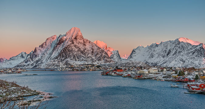 Panoramic view to Reinefjorden with mountains on background at sunrise - Reine, Lofoten Islands, Norway