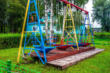 Russia, Republic of Karelia, August 2016: Old Soviet swings in the suburbs