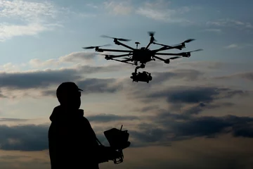 Fotobehang drone pilot, UAV , Multirotor, Photography,  Helicopter   © wip-studio
