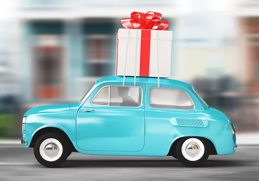 Illustrazione Stock Auto con pacco regalo gigante | Adobe Stock