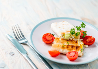 Brunch containing vegan sandwich and cut tomatoes