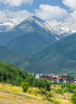 Beautiful view of the Bansko. Snow covered peaks of the Pirin mountains on background - Pirin National Park, Bulgaria