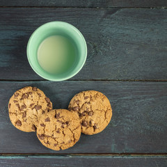 Chocolate chips cookies with glass of milk and copyspace