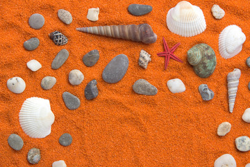 Fototapeta na wymiar Beautiful background of colored sand, shells, stones and place for an inscription