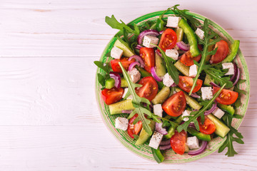 Traditional Bulgarian salad Shopski with fresh vegetables and feta