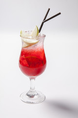 Cold straw red drink with berry, apple and mint leaf.