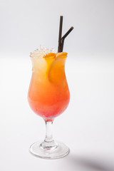 Tequila sunrise cocktail with ice on white background. Isolated