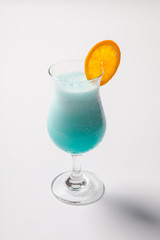 blue Hawaiian cocktail with a slice of orange