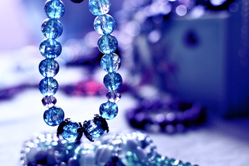 Colored crystal bracelet and a pile of bijou items