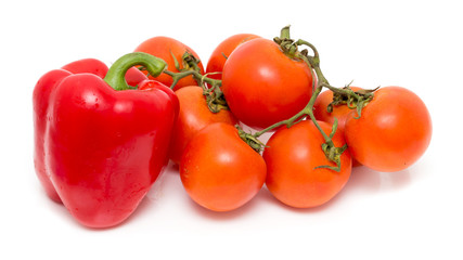 Red paprika and tomato on white background