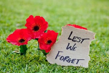 Lest We Forget - Anzac - Rememberance - poppys with written message
