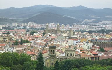 Fototapeta na wymiar Panoramic view of Pamplona on the background of mountains. Navarre, Spain.