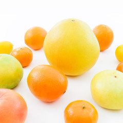 Fruit background. Citrus fruits on white background. Flat lay, top view.