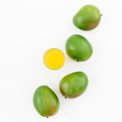 Juice made of mangos and fruits on white background. Flat lay, top view.