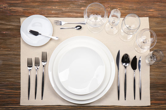 Table setting on wooden background