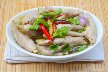 Chicken feet in a bowl with spicy soup,thai food
