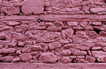 Pink stone wall with wood