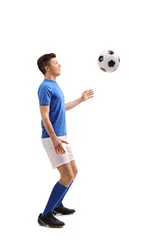 Tuinposter Teenage soccer player with a football © Ljupco Smokovski