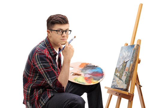 Teenage painter with a paintbrush and a palette