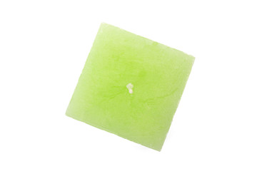 Green candle top on white background