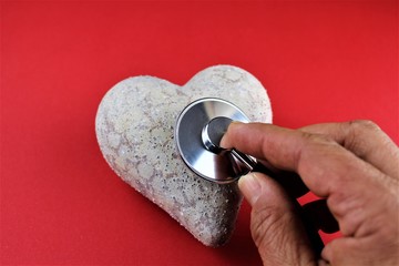 An image of a heart and a stathoscope