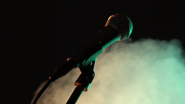 Microphone on stand in smoke. Music, Sound, Band, Concept.