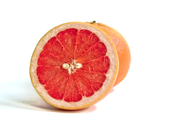 Closeup of red grapefruits on a white background